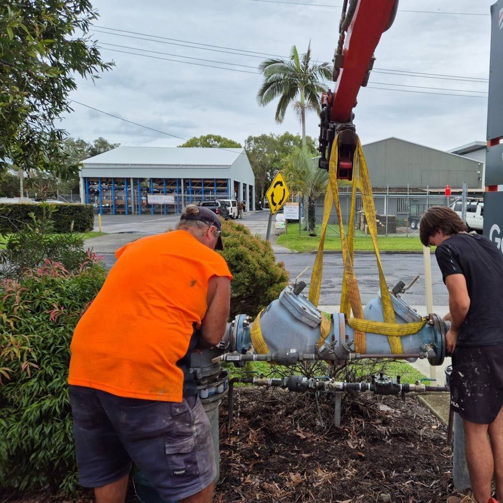 Plumbers Doing Maintenance on Backflow Device