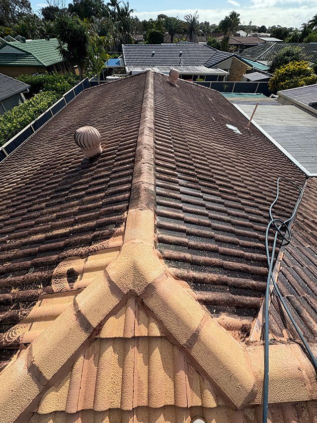An Aerial View of a Tiled Roof of a House — Boss Roof Tiling and Restoration in Caboolture, QLD