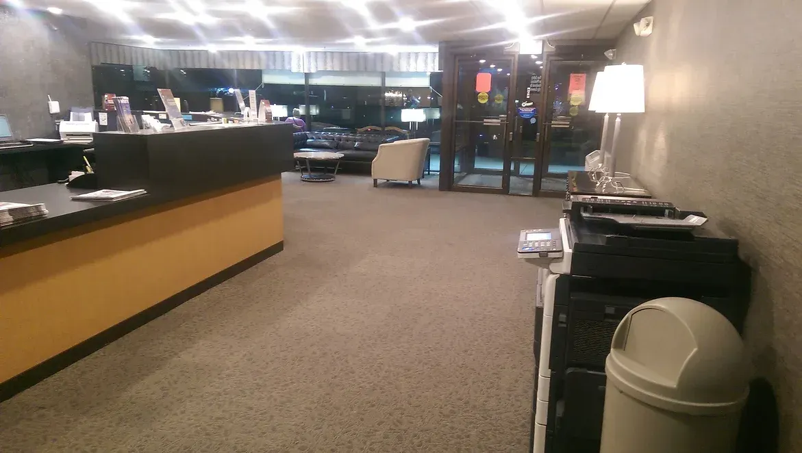 There is a trash can in the middle of the room.