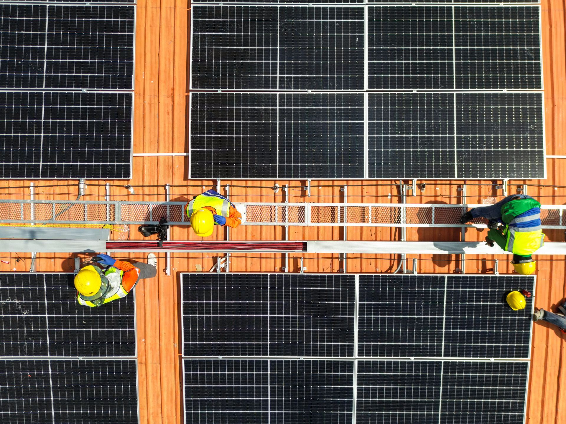 engineer man inspects construction of solar cell panel or photovoltaic cell at roof top
