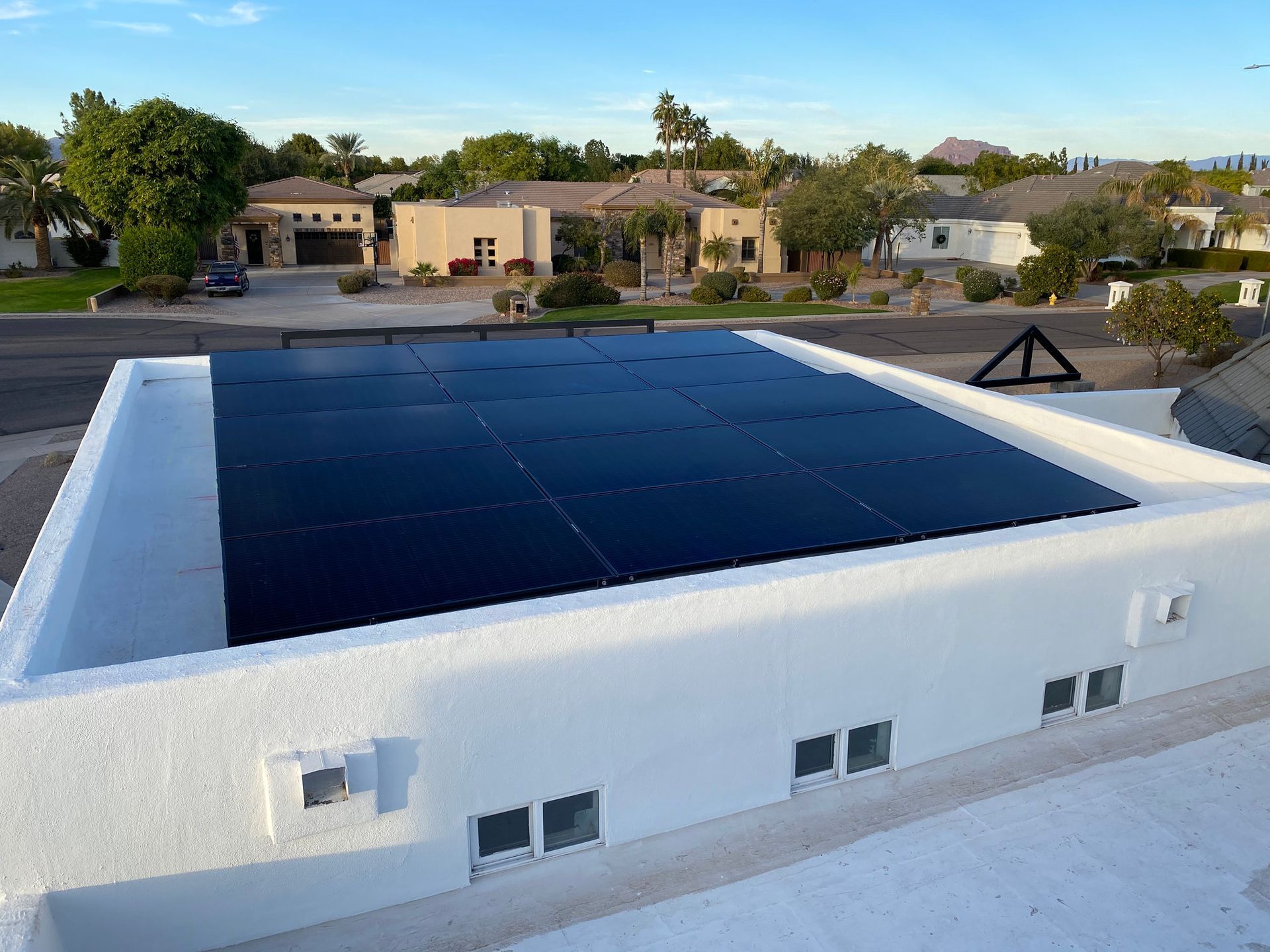 A roof with a lot of solar panels on it Cheyenne Wyoming flat roof solar installation