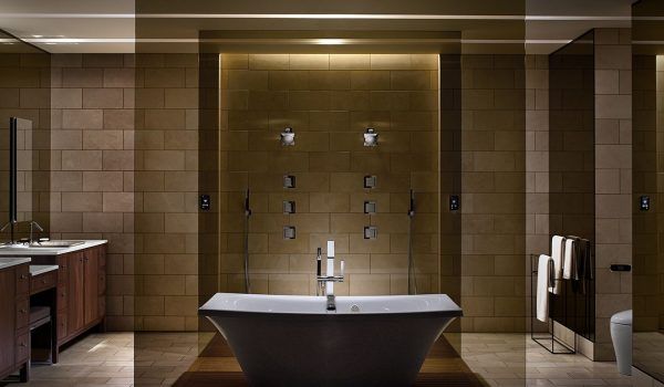 A bathroom with a bathtub and a shower