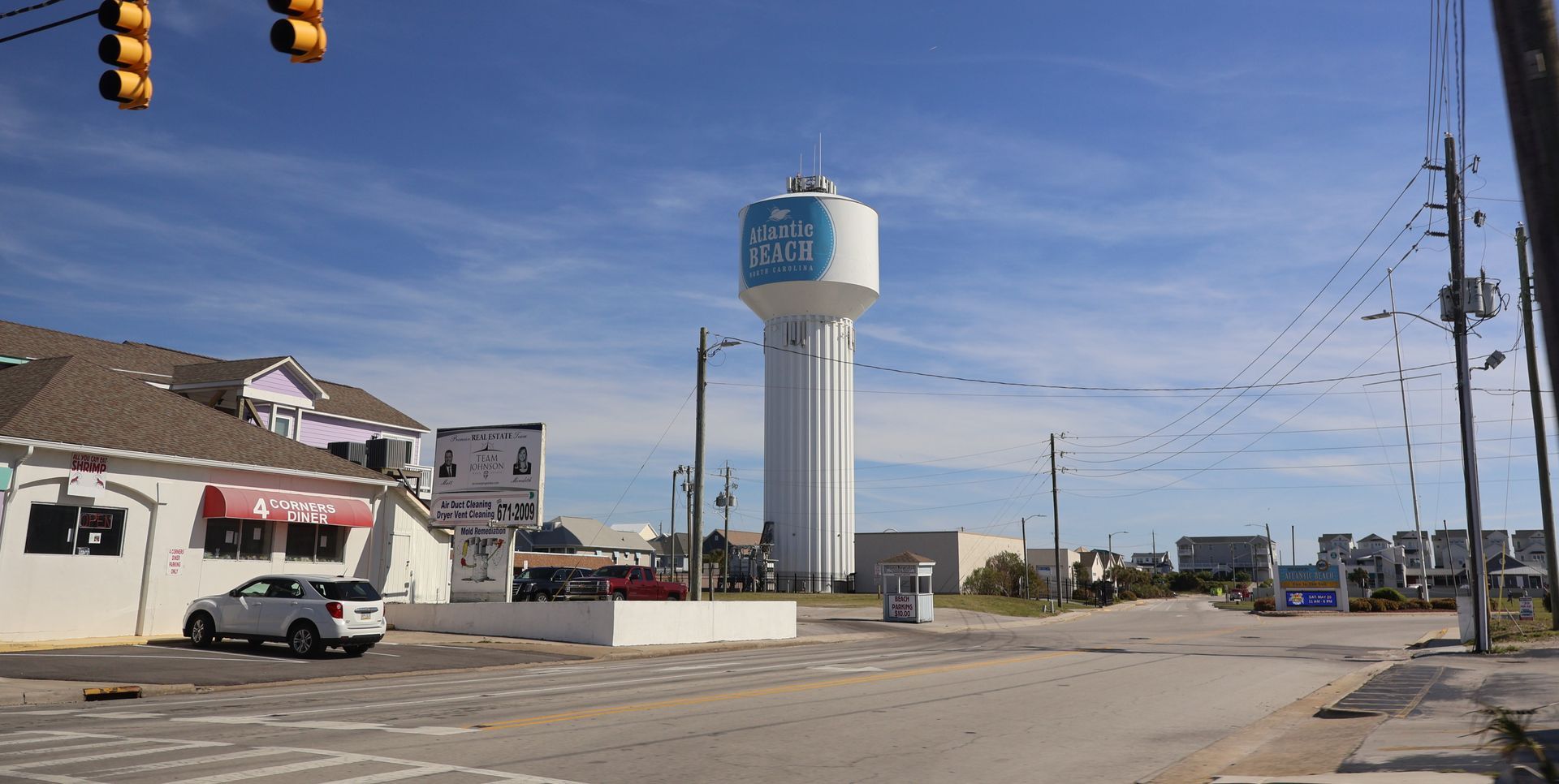 Aerial view of Miami Beach, Florida, with ocean on the right, buildings and a canal on the left.