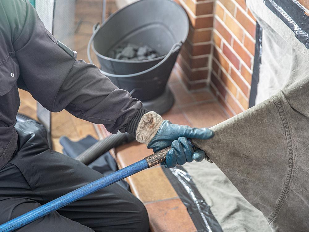 Chimney flue cleaning in Mineola, NY by Fred's Chimney Magic Inc. ensuring safety and efficiency for your fireplace.