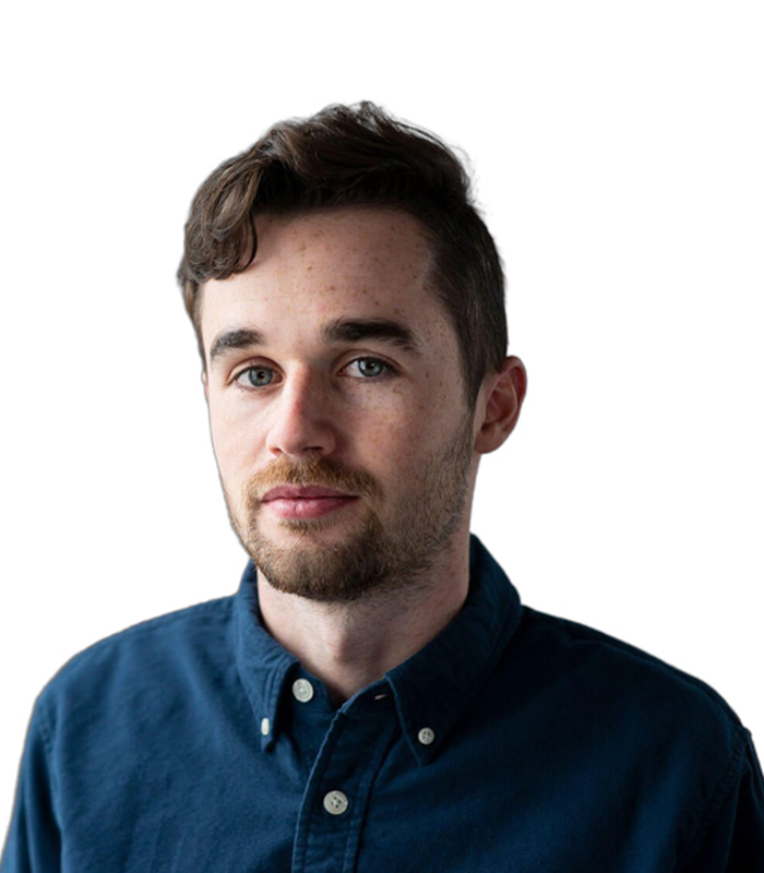 A man with a beard is wearing a blue shirt