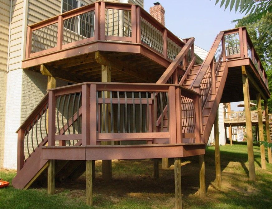 A wooden deck with stairs leading up to it