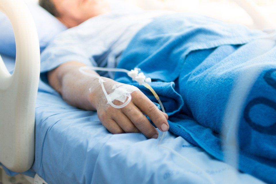 Patient lying on hospital bed