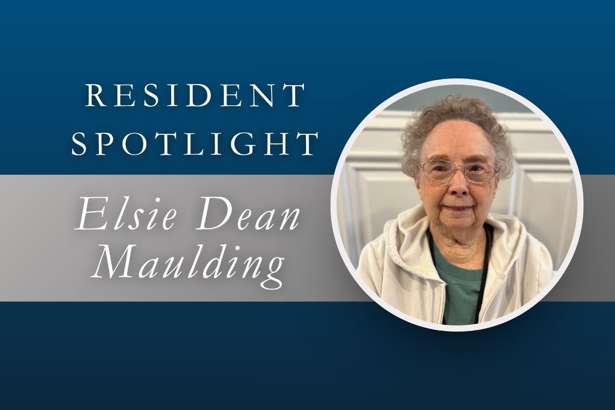 Resident spotlight for Elsie Dean Maulding. Woman in a circle, smiling, in a white jacket.