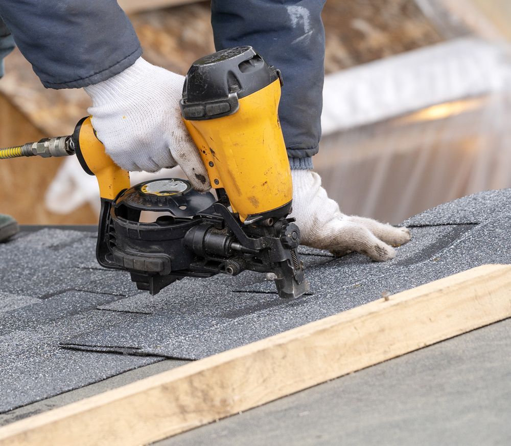 Professional Worker Installing New Roof Shingles