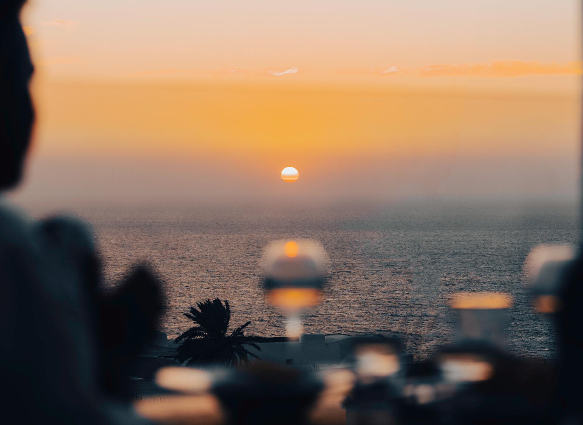 A blurry picture of a sunset over the ocean