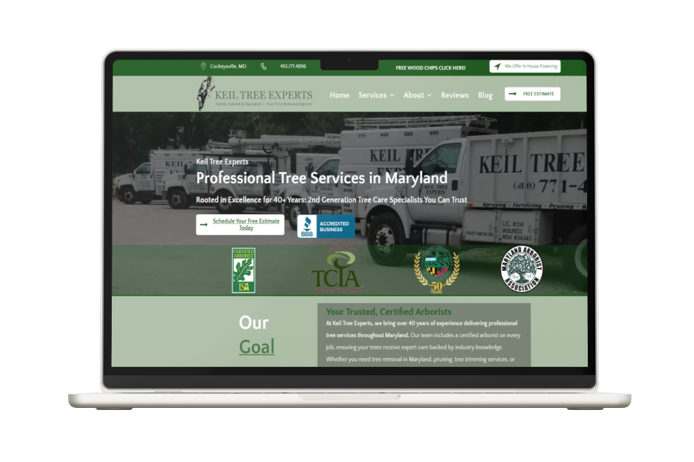 Laptop displaying Keil Tree Experts website, showing tree service trucks and logo.