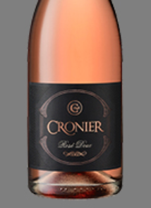 A bottle of cronier wine with a black label