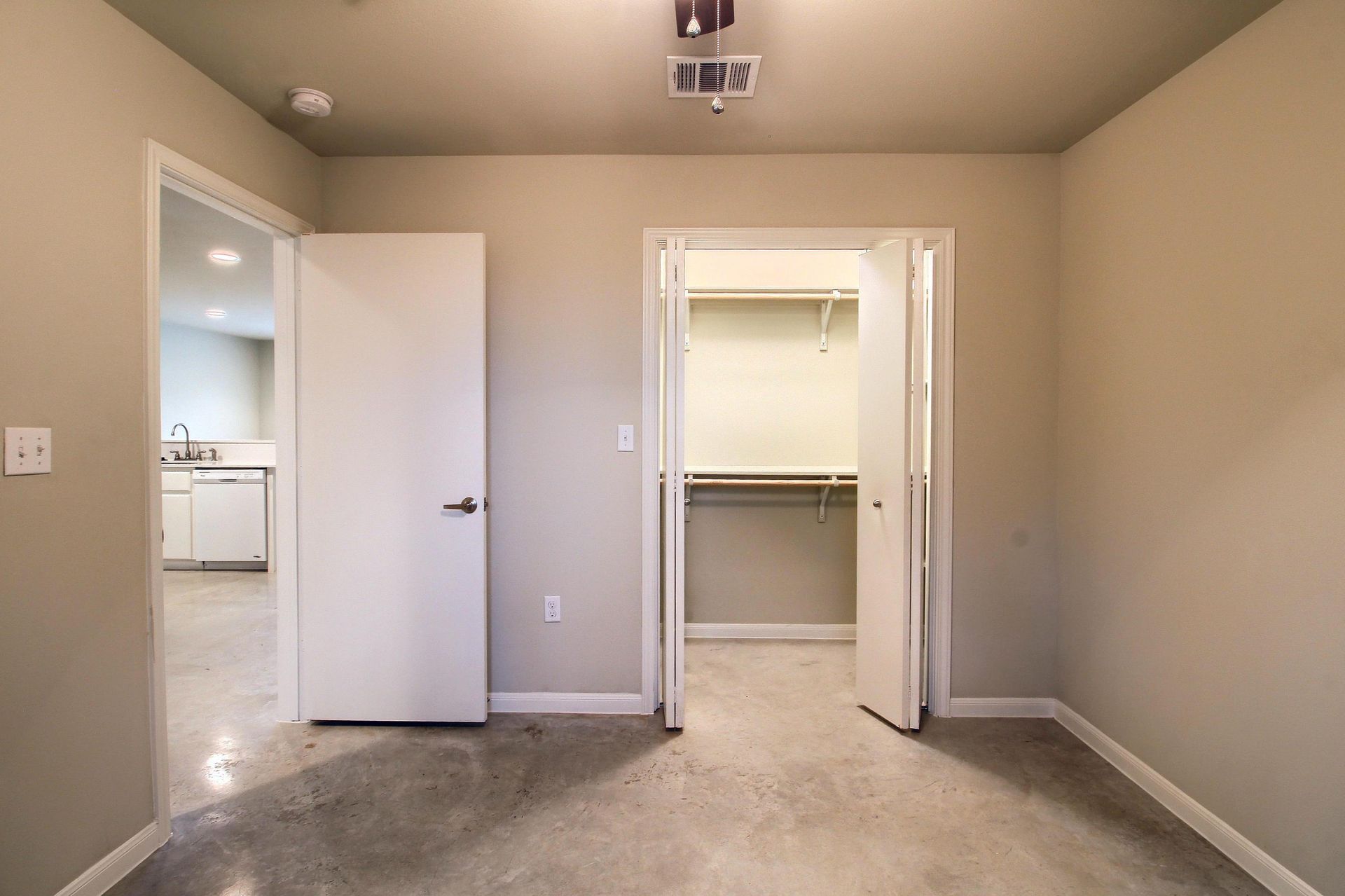 There is a walk in closet in the middle of the room.