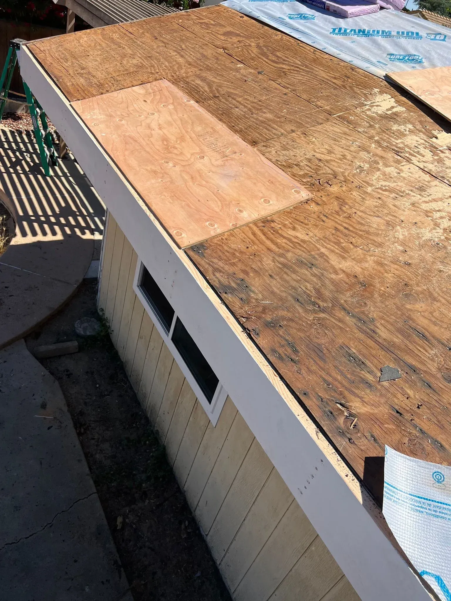 A house with a roof that is being repaired.