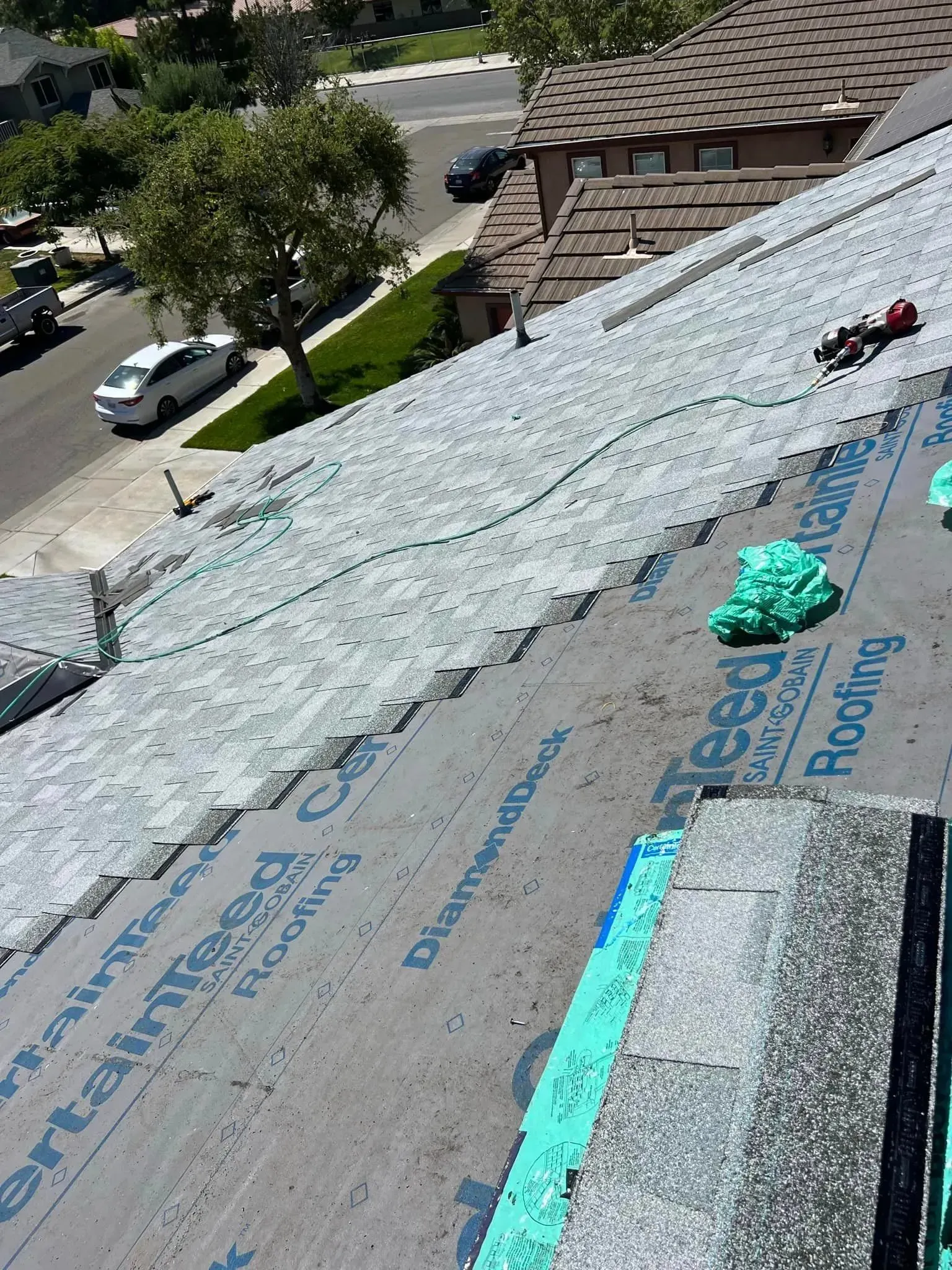 An aerial view of a roof that is being repaired.