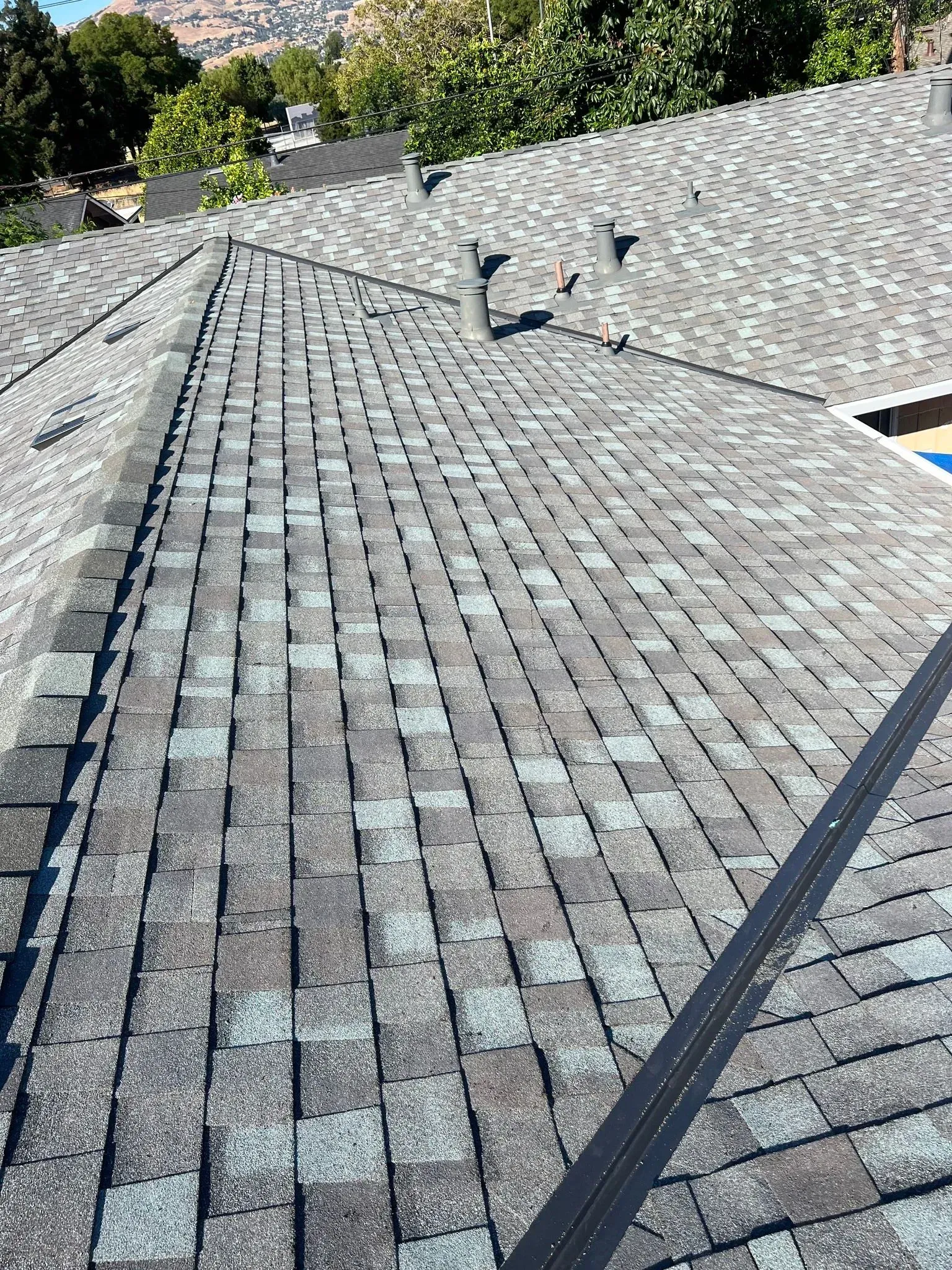 A close up of a roof with shingles on it.