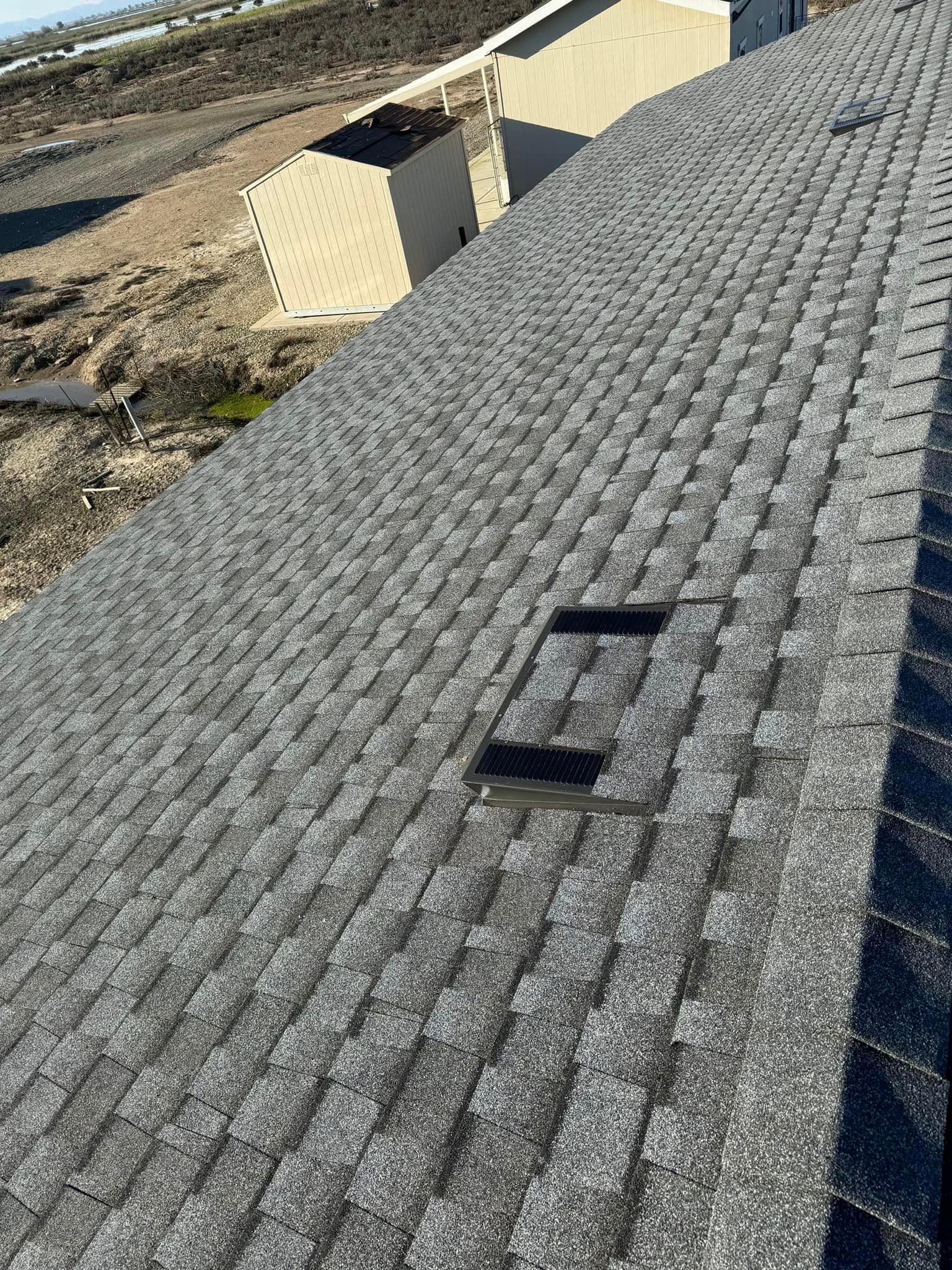 A close up of a roof with shingles on it.