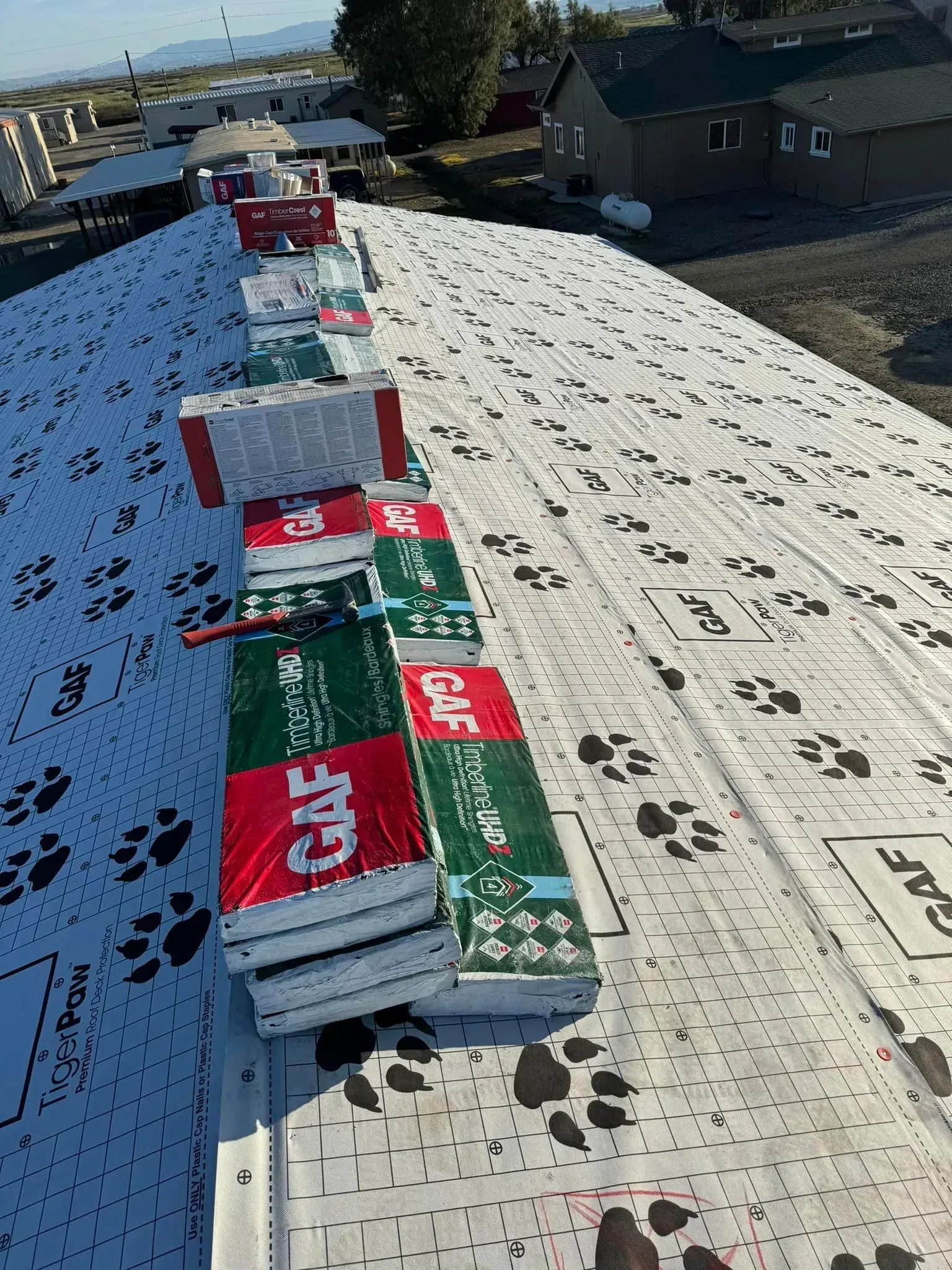 A roof with a lot of roofing materials on it.