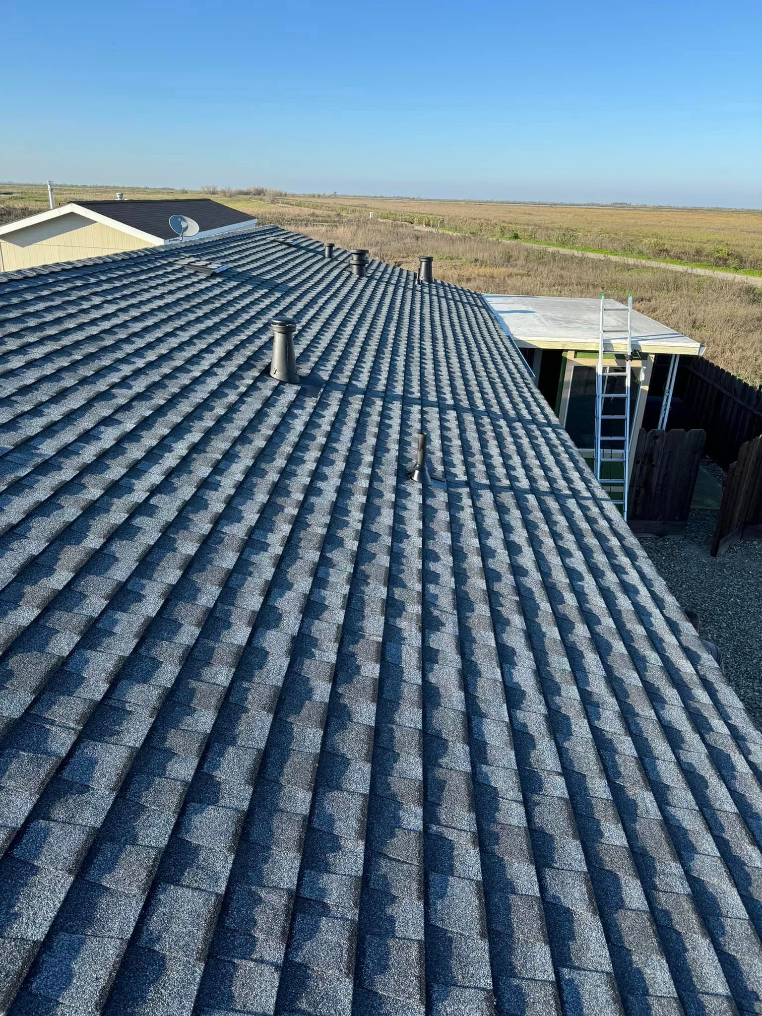 A close up of a roof with a ladder on it.