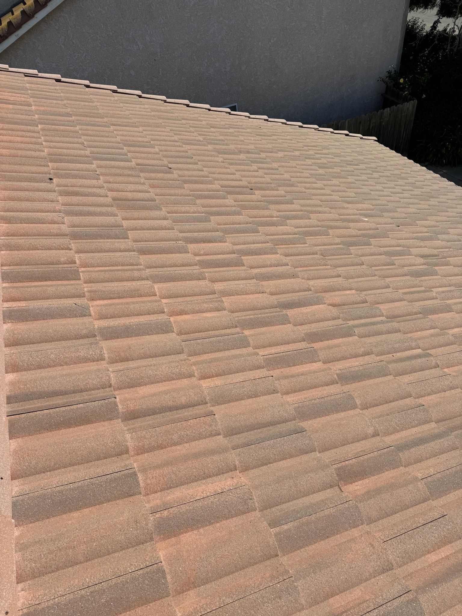 A close up of a tiled roof of a house.
