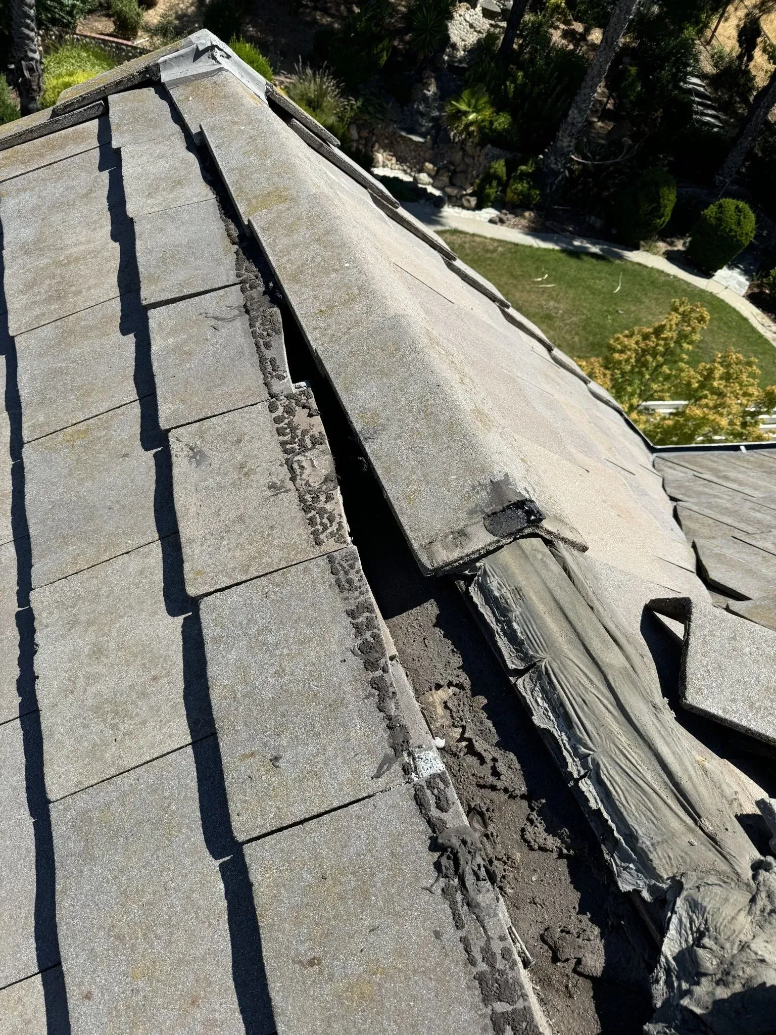 A close up of a roof with a hole in it.
