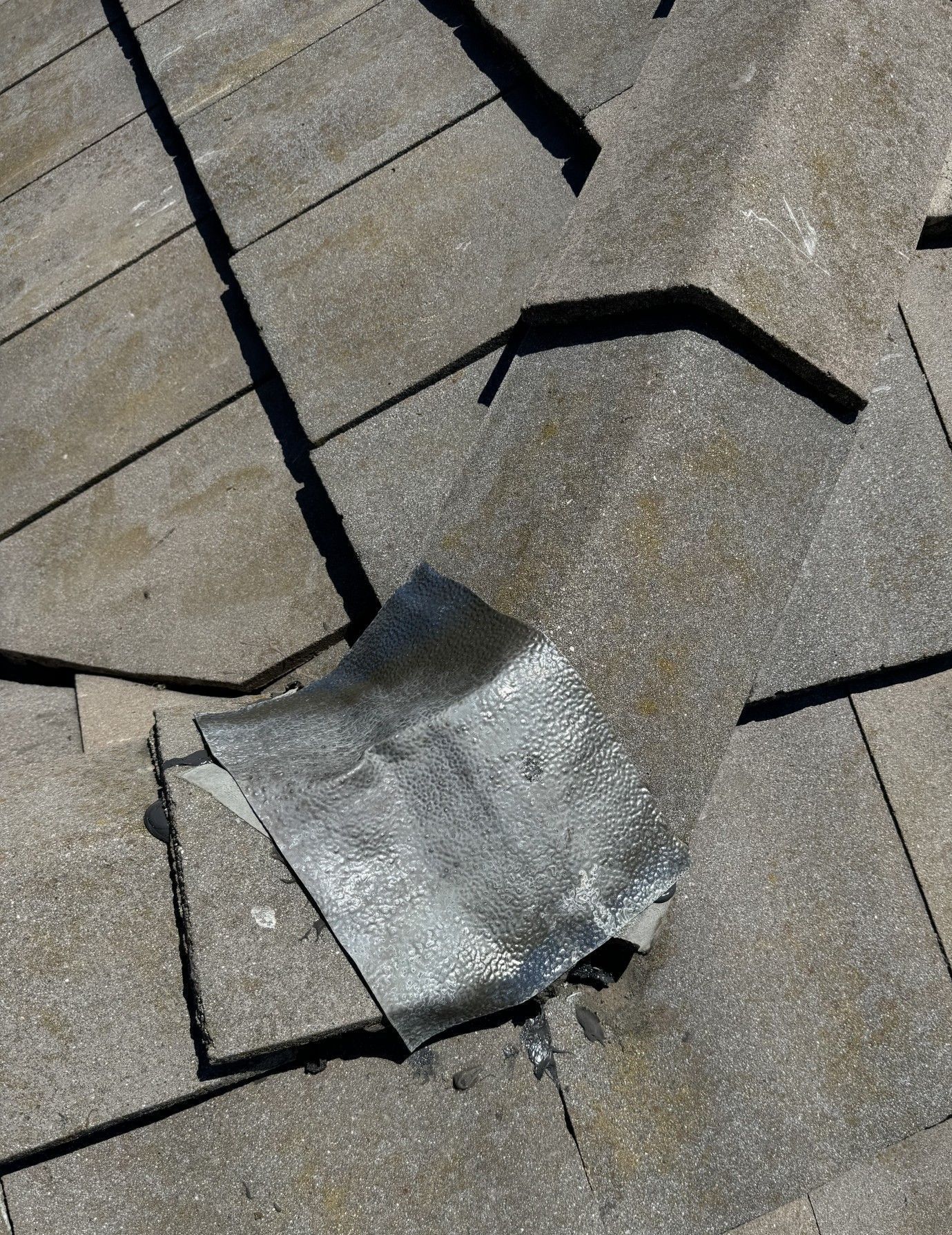 A close up of a roof with a hole in it.