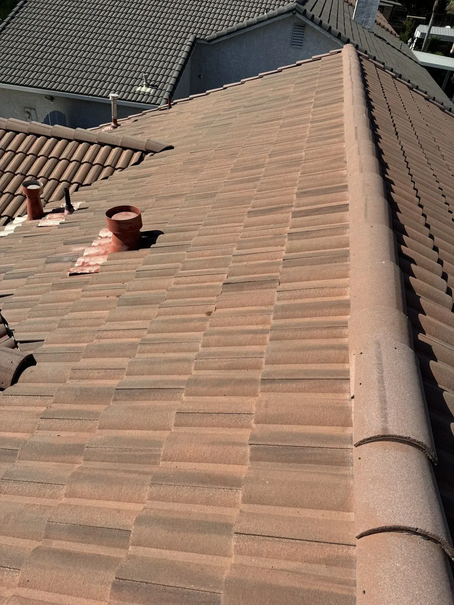 A close up of a roof with a chimney on it