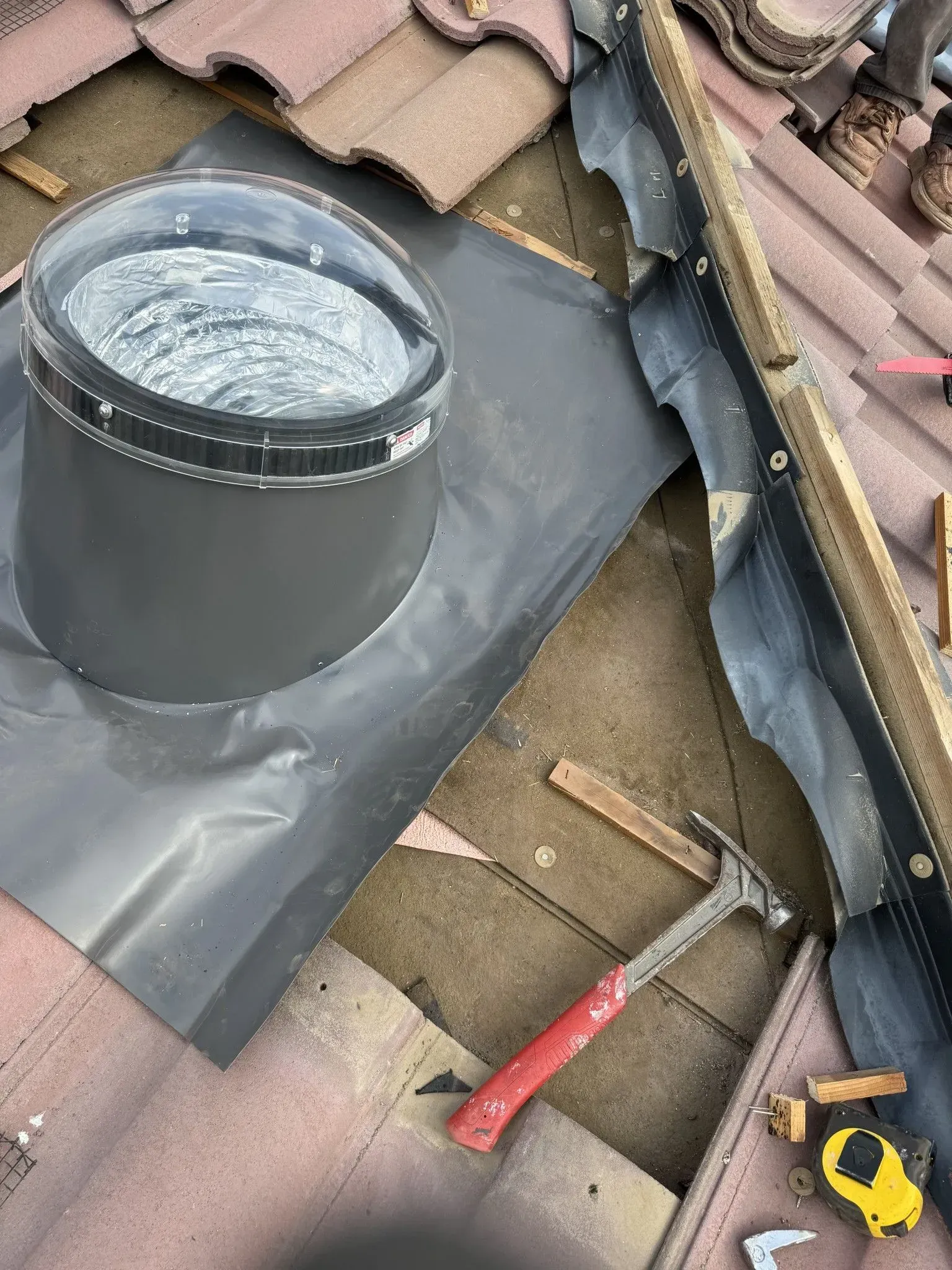 A skylight is being installed on the roof of a building.