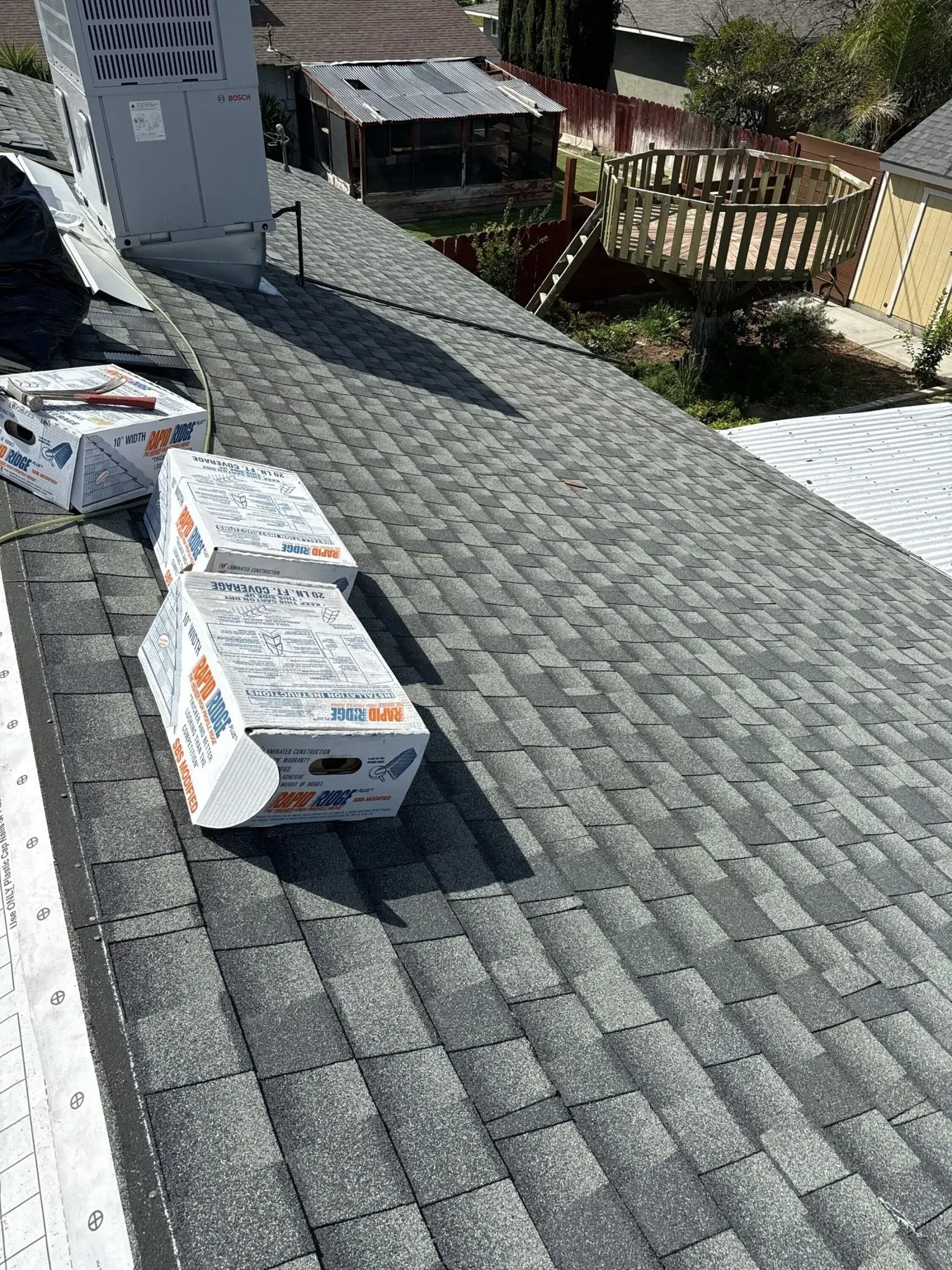 A roof with boxes sitting on top of it.