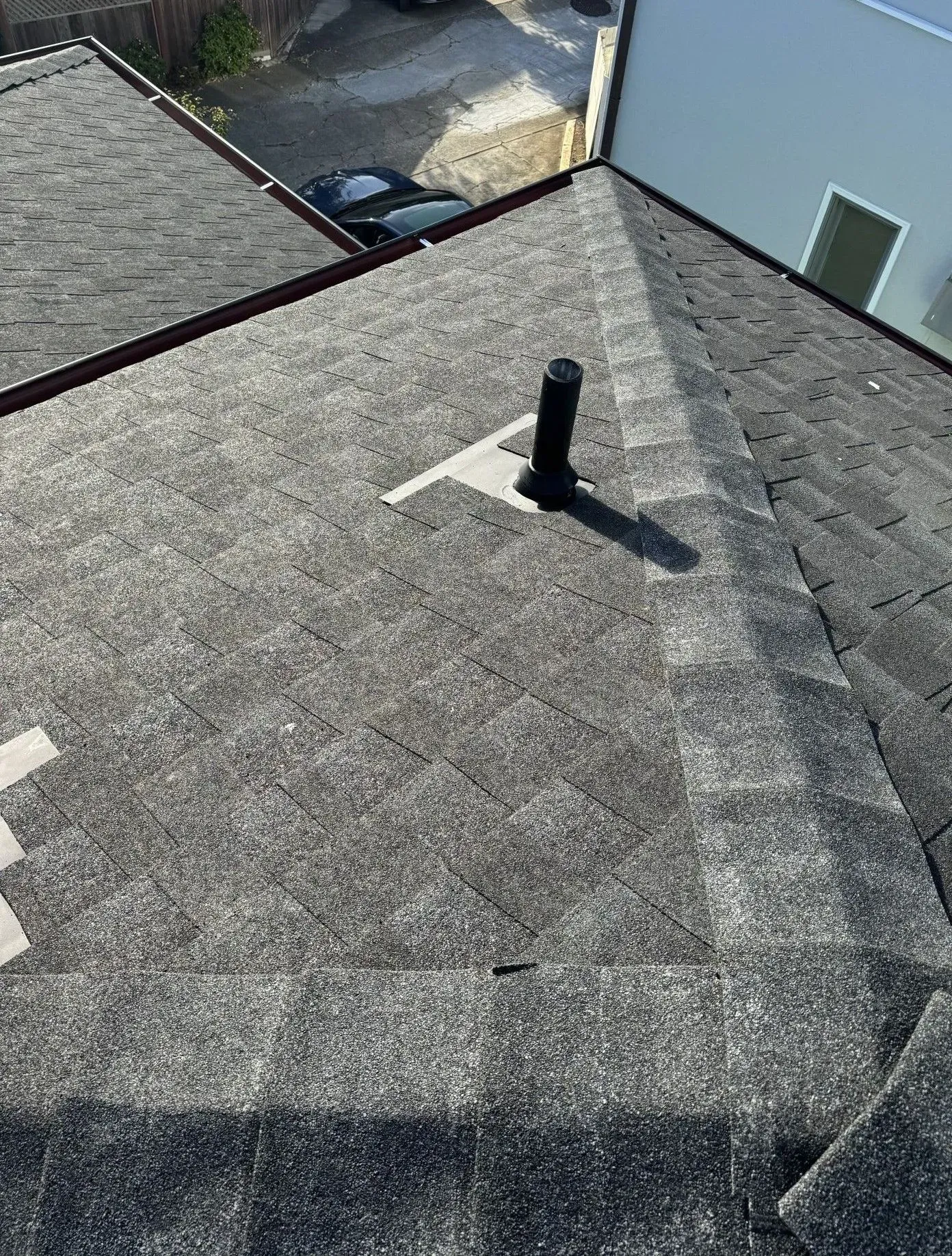 An aerial view of a roof with a chimney on it.
