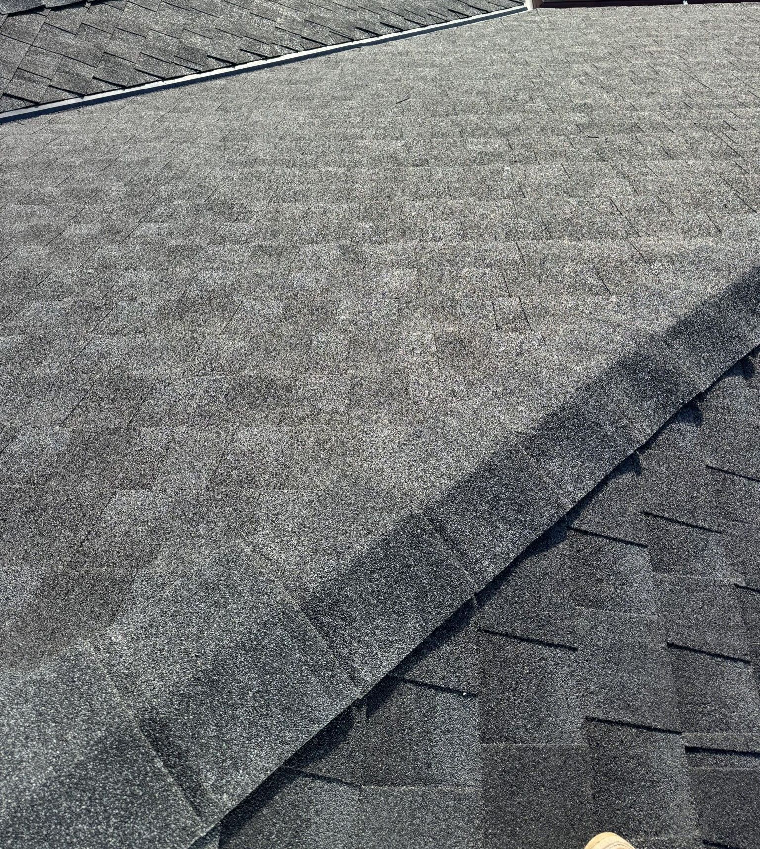 A close up of a roof with shingles on it.