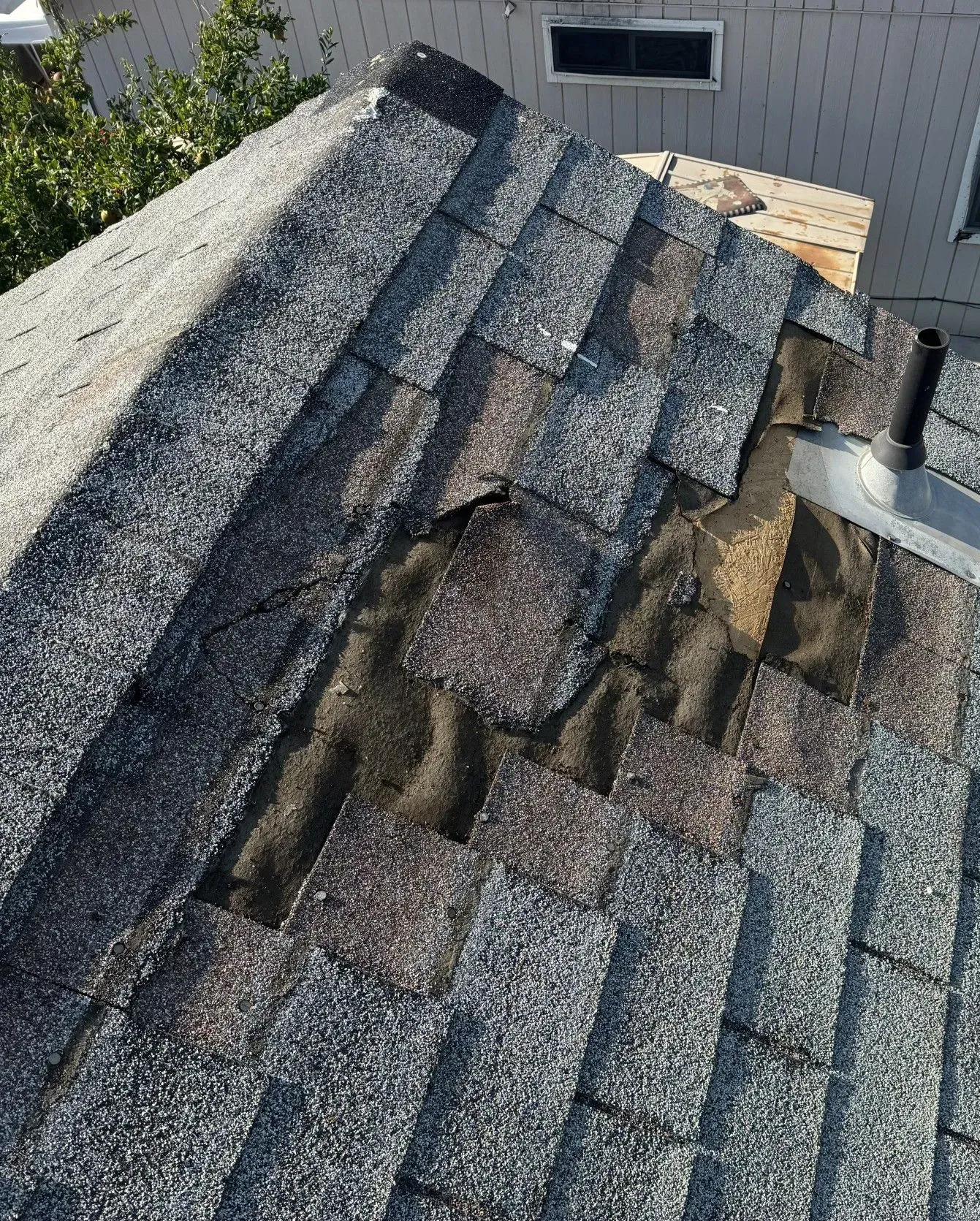 A close up of a roof with a hole in it.