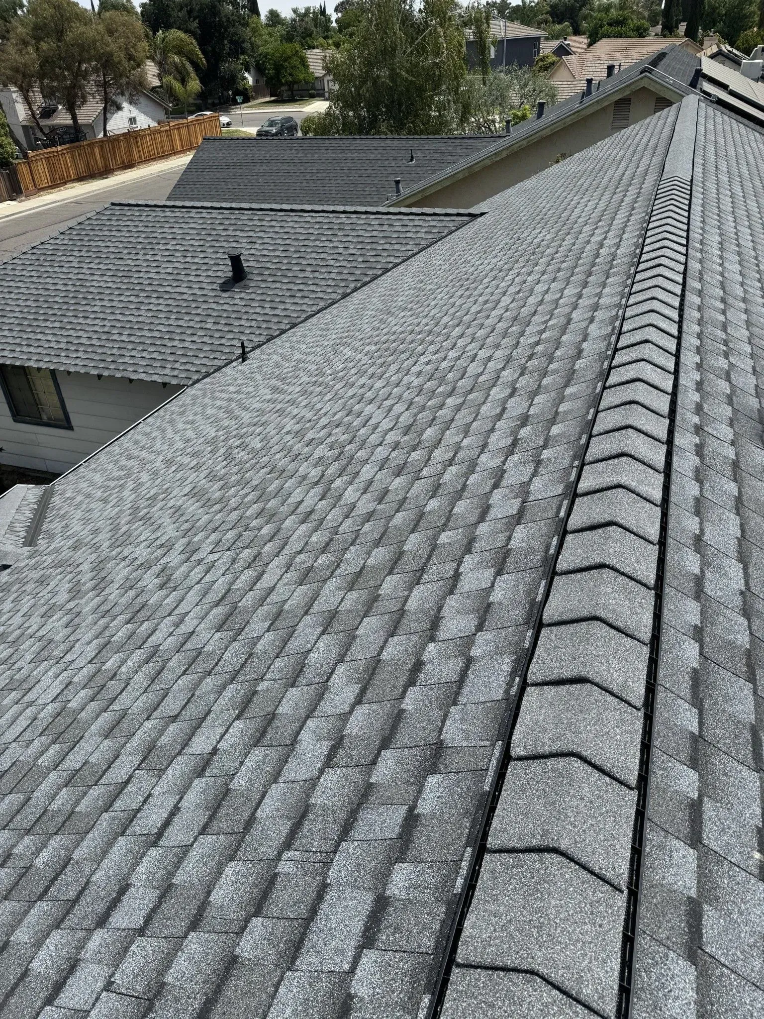A close up of a roof with a lot of shingles on it.