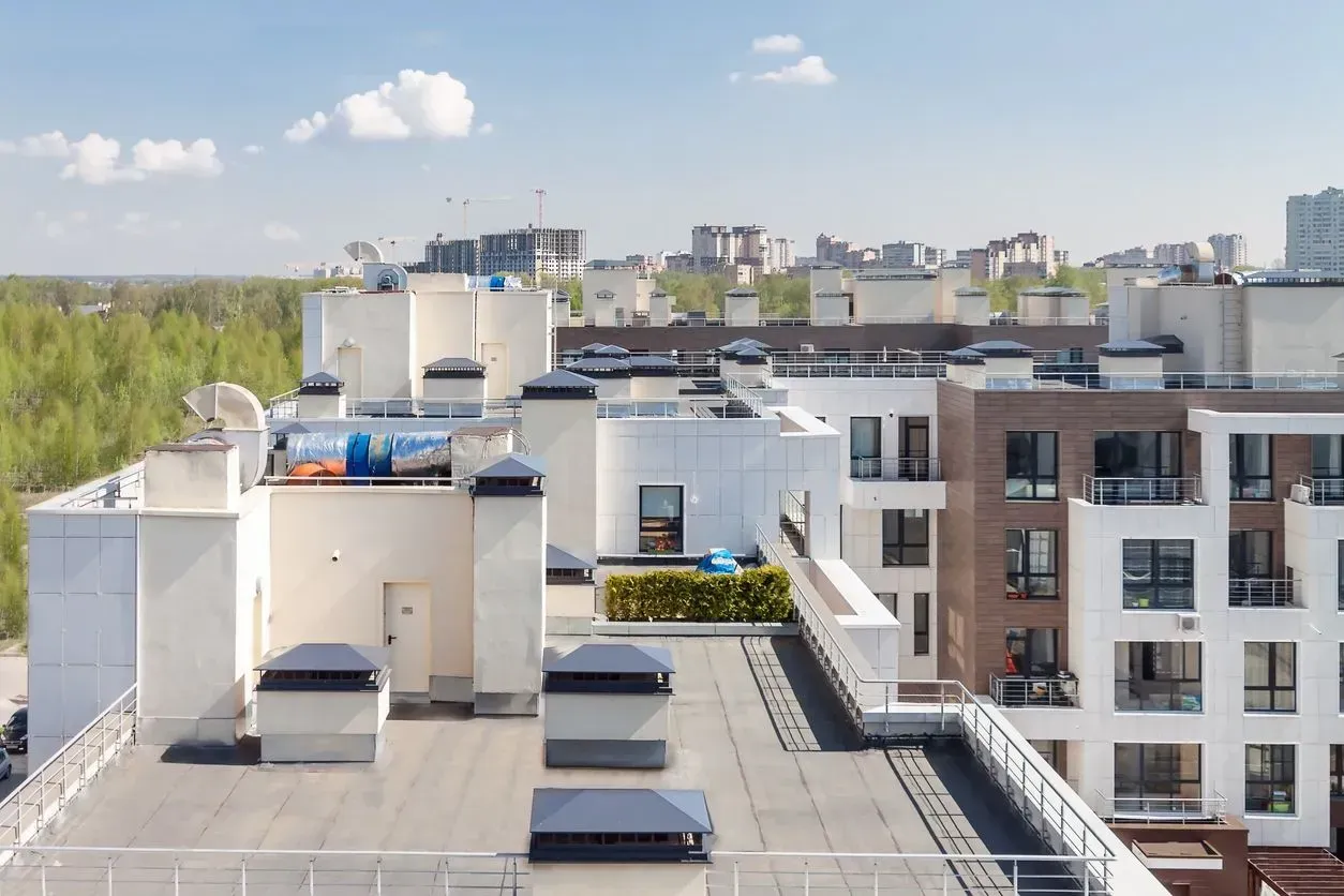 The roof of a building with a lot of chimneys on it.