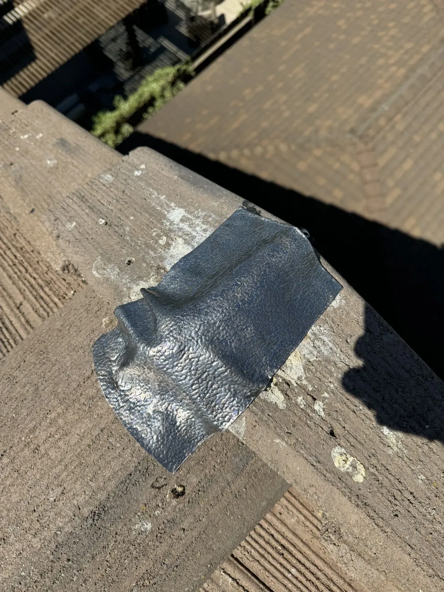 A piece of tape is sitting on the side of a building.