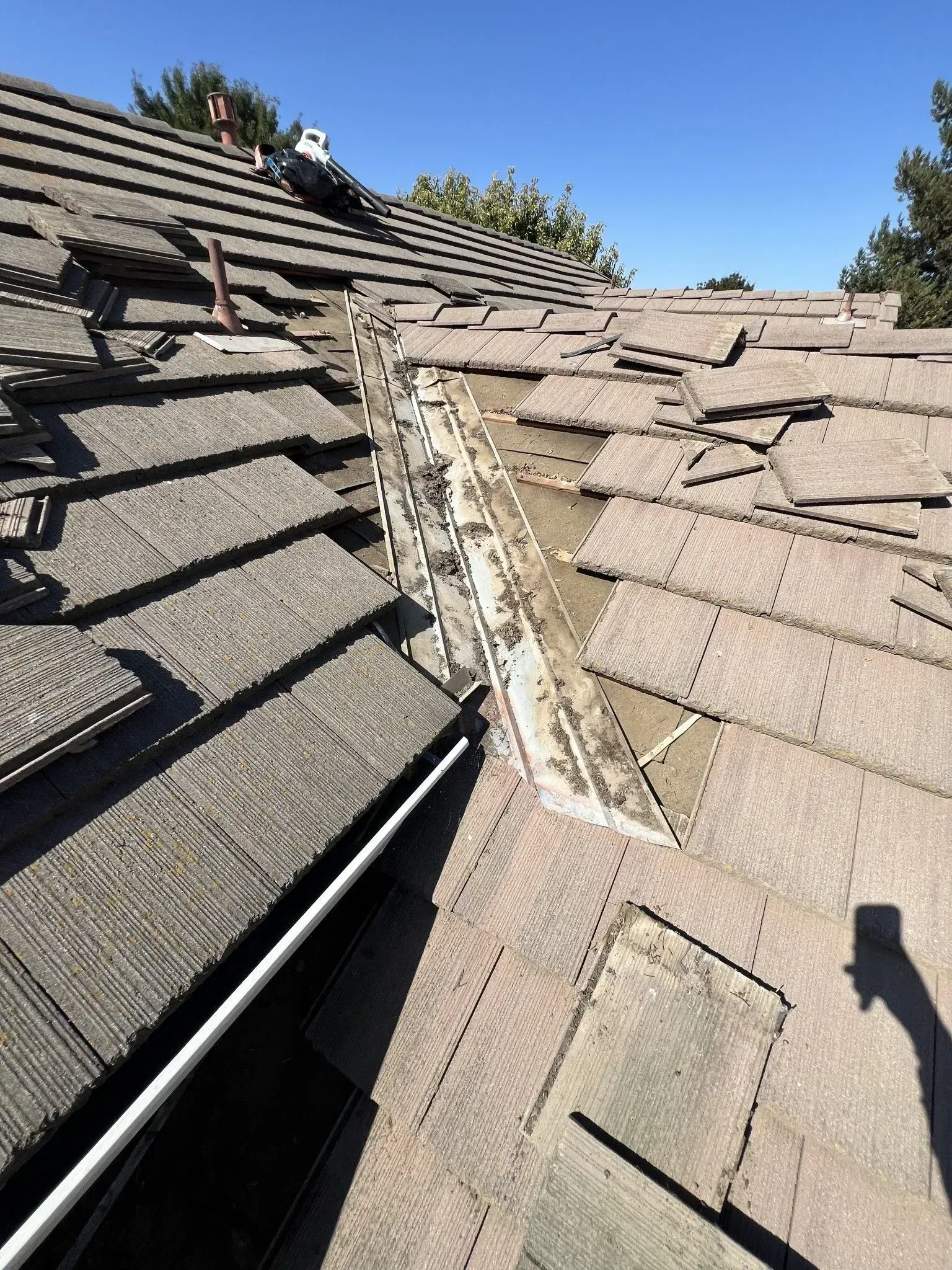 A close up of a roof with a hole in it.