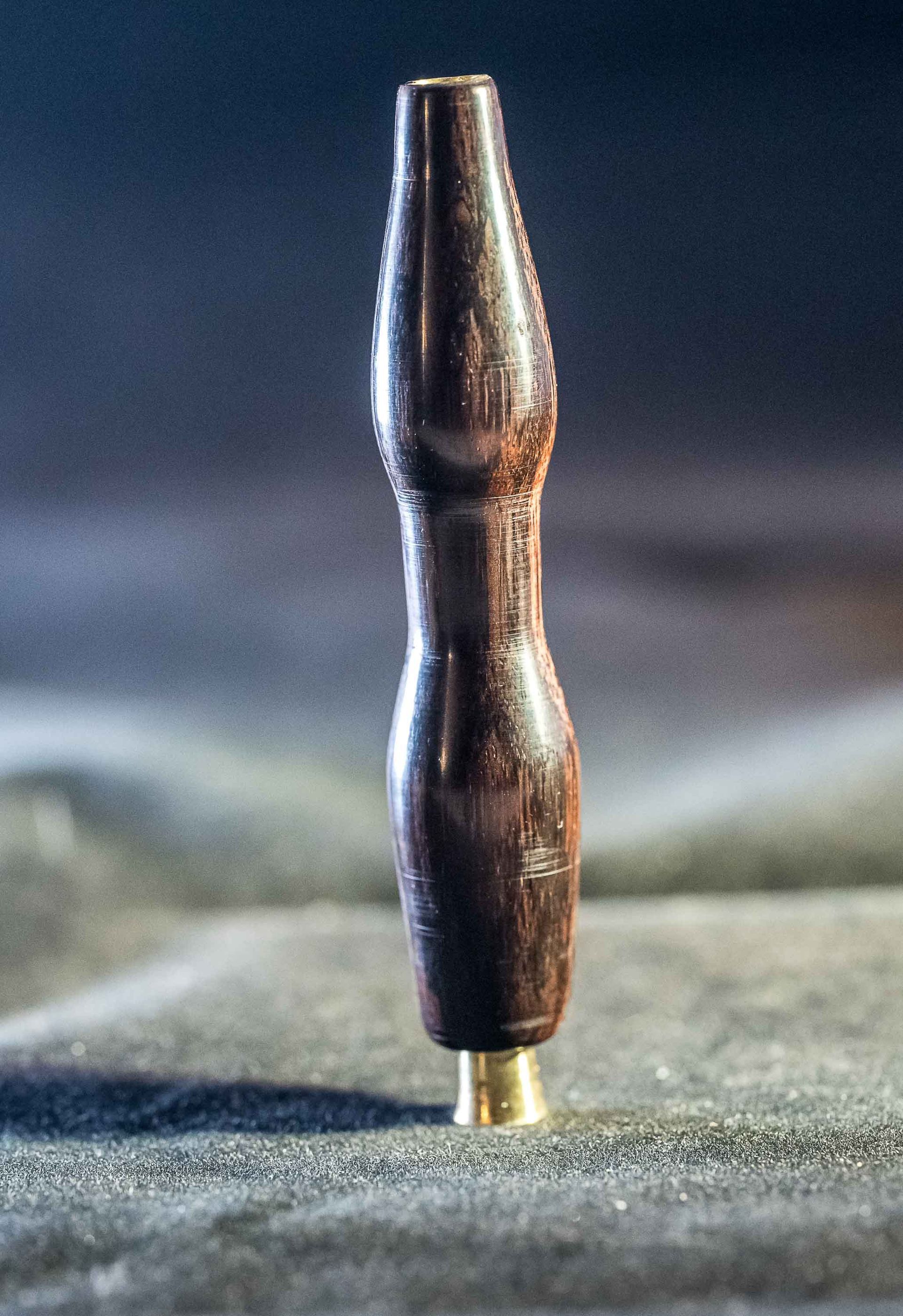 A small wooden object is sitting on a table