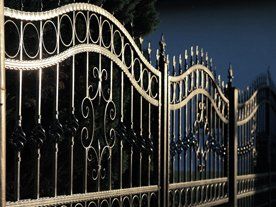 A wrought iron gate with a wavy design