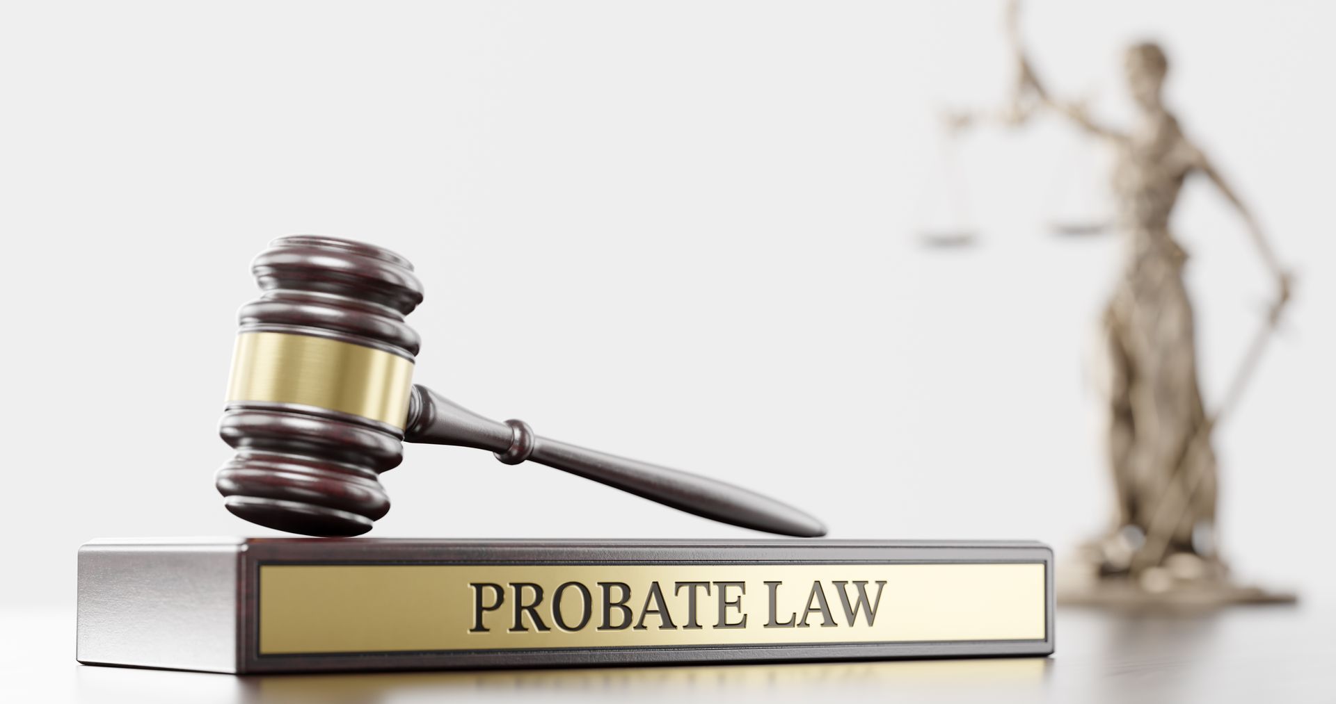A gavel is sitting on top of a book titled probate law.