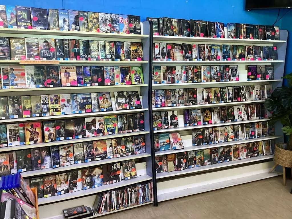 A Store Filled With Lots of Dvds on Shelves — West End Cash Store In Proserpine, QLD
