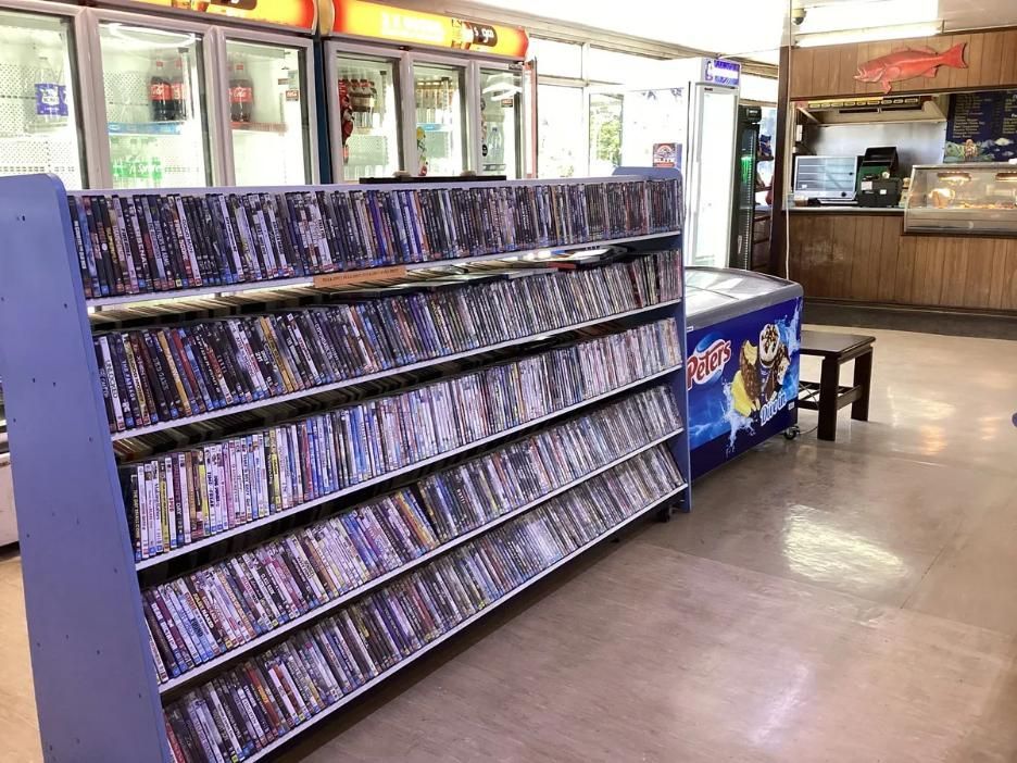 A Store Filled With Lots of Cds and Dvds — West End Cash Store In Proserpine, QLD