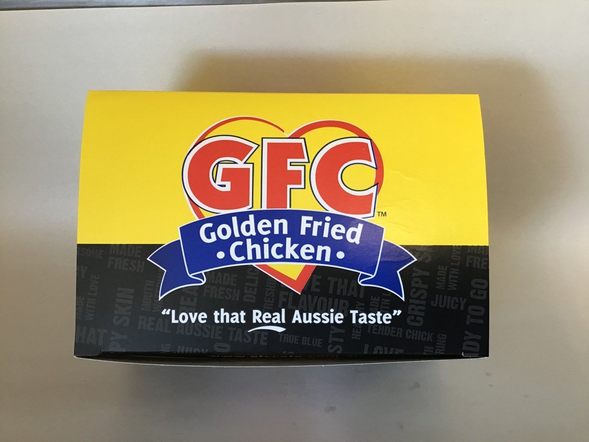A Box of Golden Fried Chicken Sitting on a Table — West End Cash Store In Proserpine, QLD
