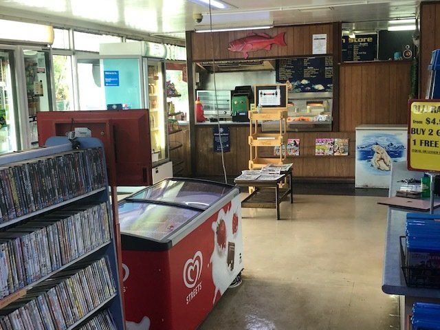 The Inside of a Store With a Sign That Says 'Ice Cream' on It — West End Cash Store In Proserpine, QLD