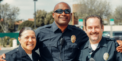 A group of police officers are posing for a picture together.