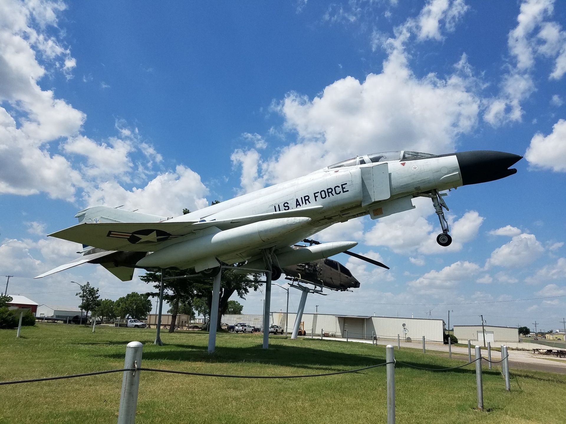 A us air force fighter jet is on display in a grassy field.