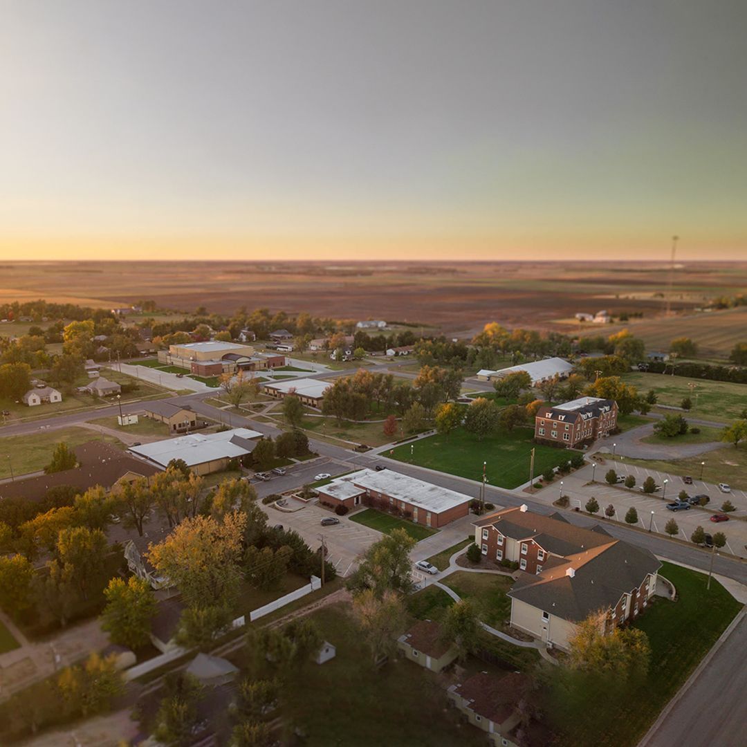 An aerial view of a small town at sunset.
