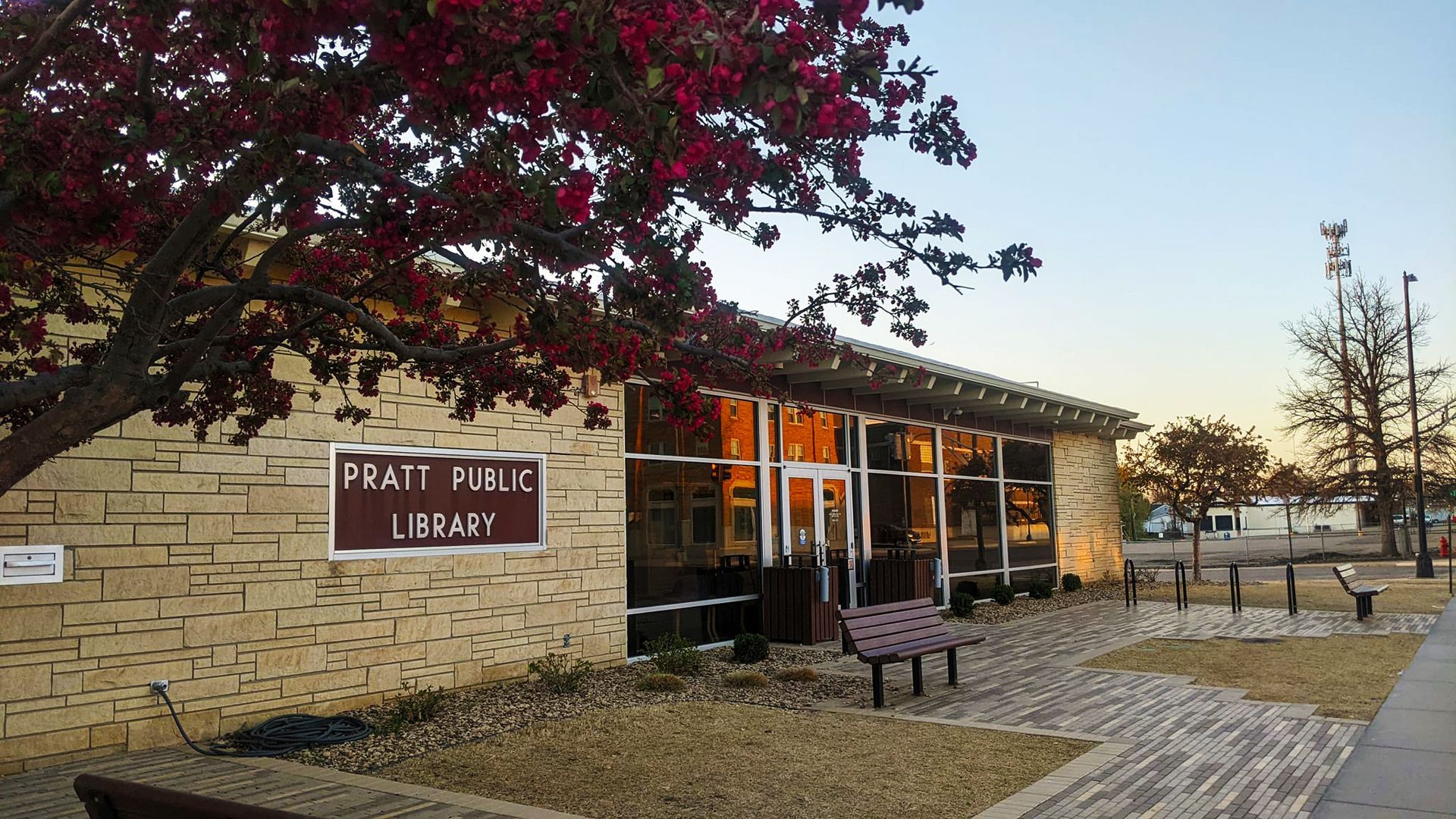 A brick building with a sign on the side that says matt