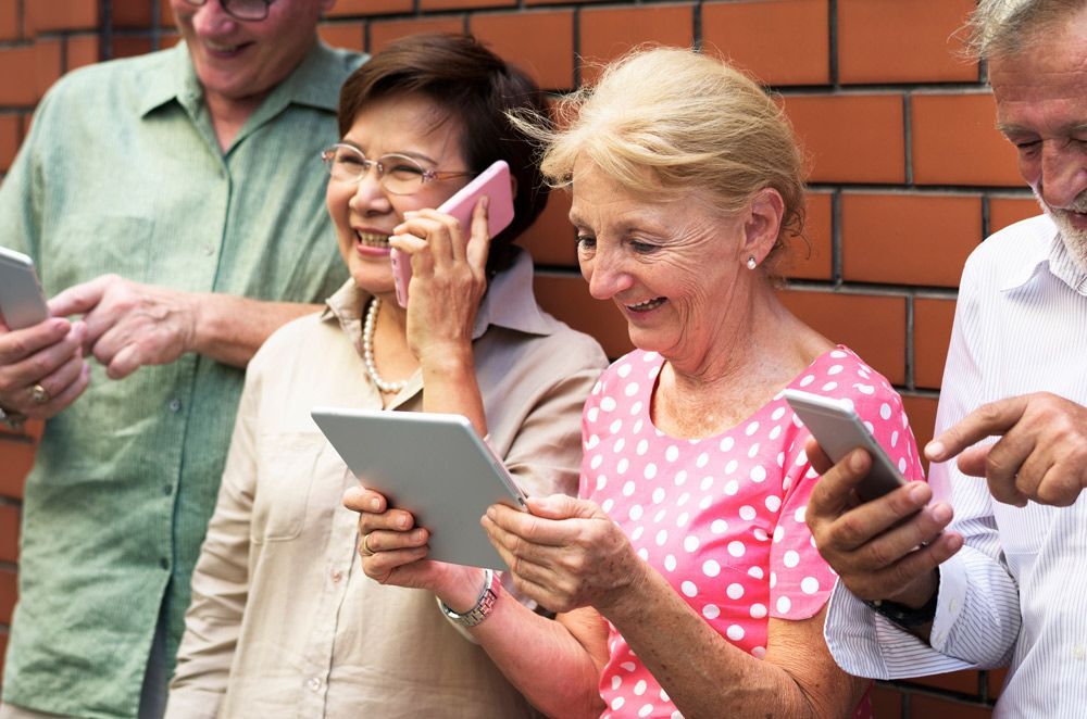 A Group of Elderly People Are Looking at Their Phones and Tablets — Tech Bias in Redbank Plains, QLD