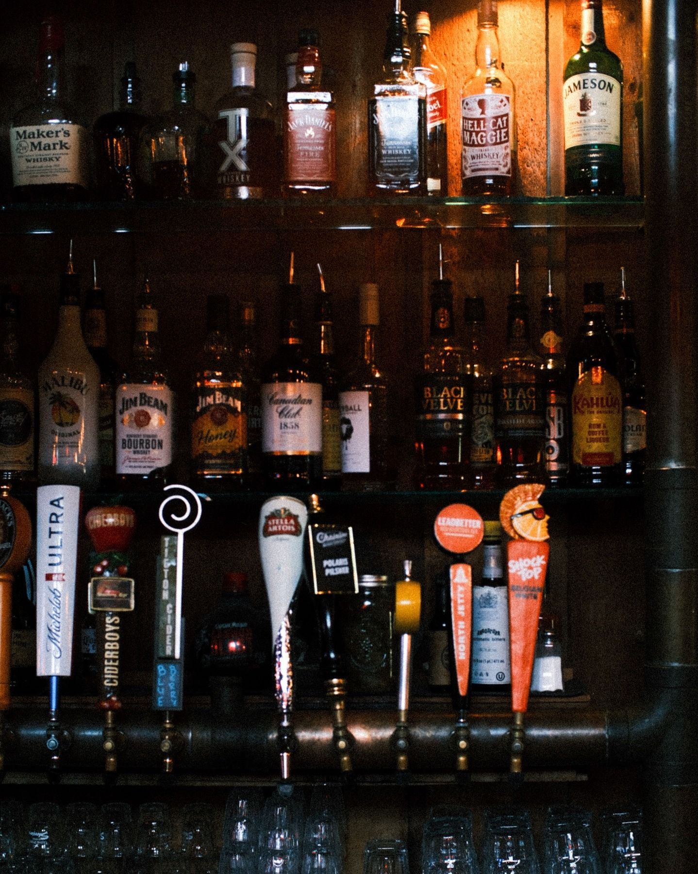 A row of beer taps with one that says coors light on it