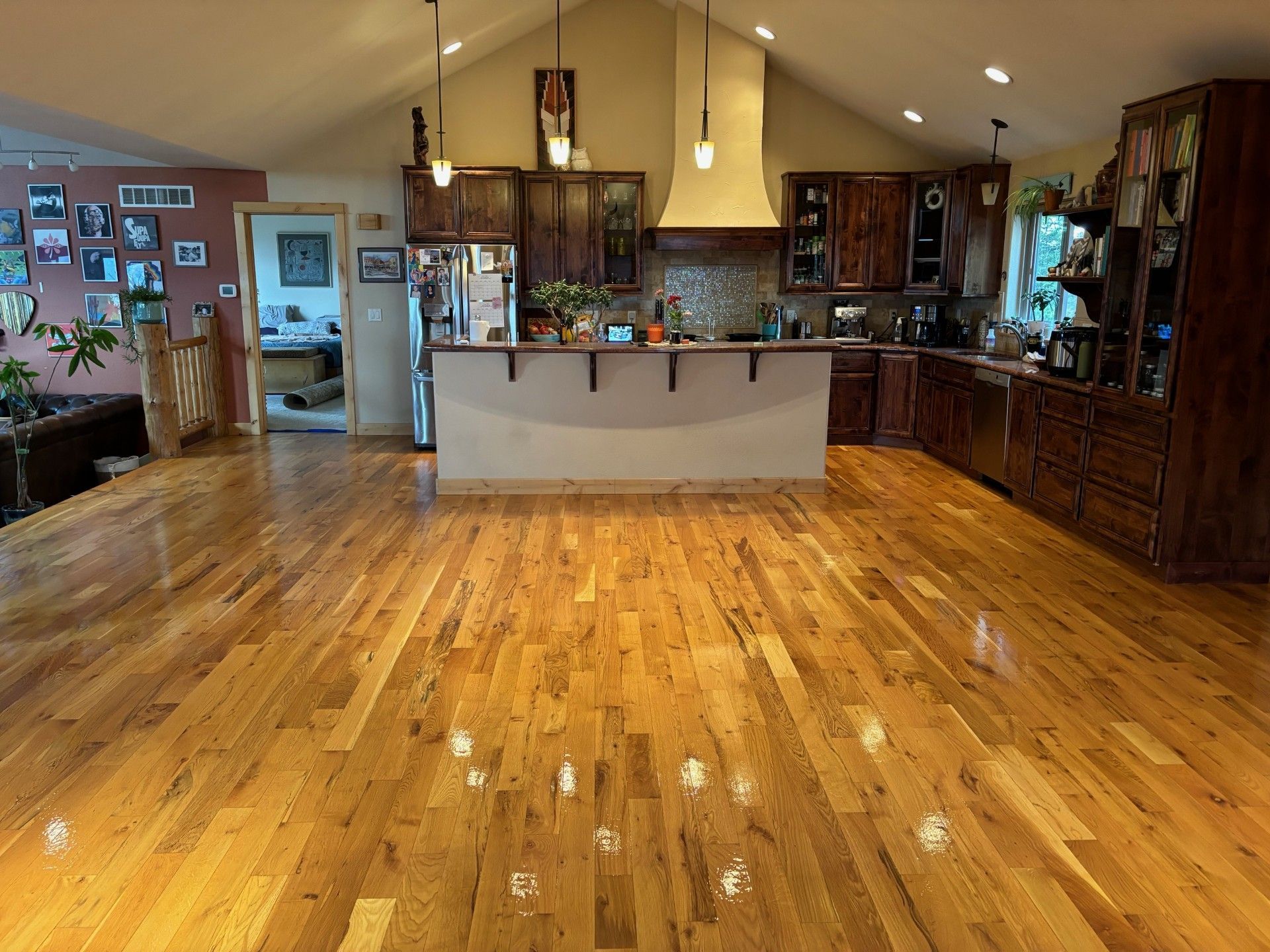 A living room with hardwood floors and sliding glass doors